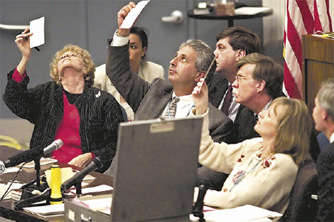 "People examining ballots"